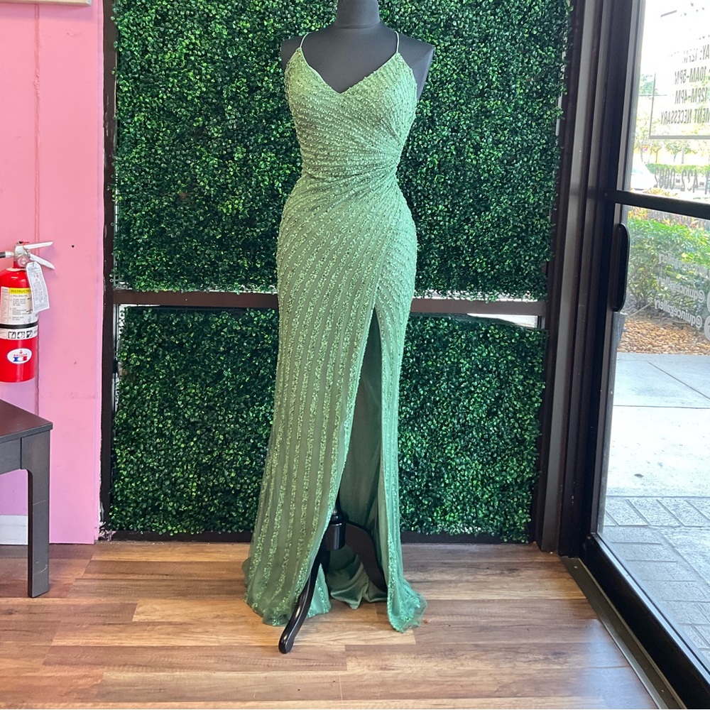 Primavera couture, sage green, deep V gown